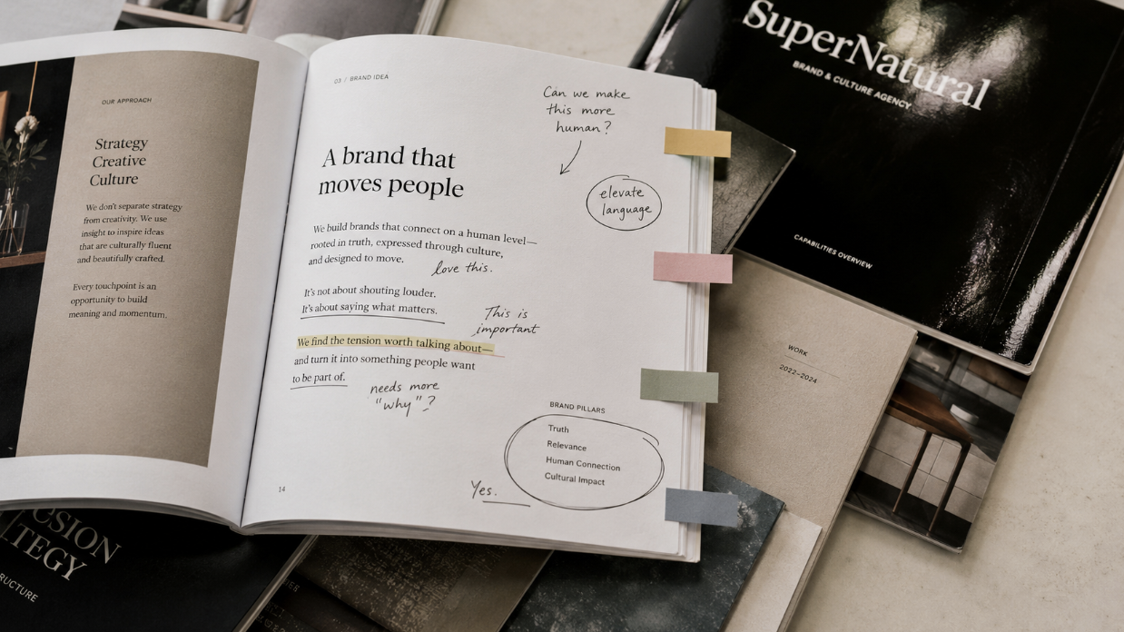 An open, annotated agency strategy document with sticky flags, illustrating how to evaluate an agency's case studies.